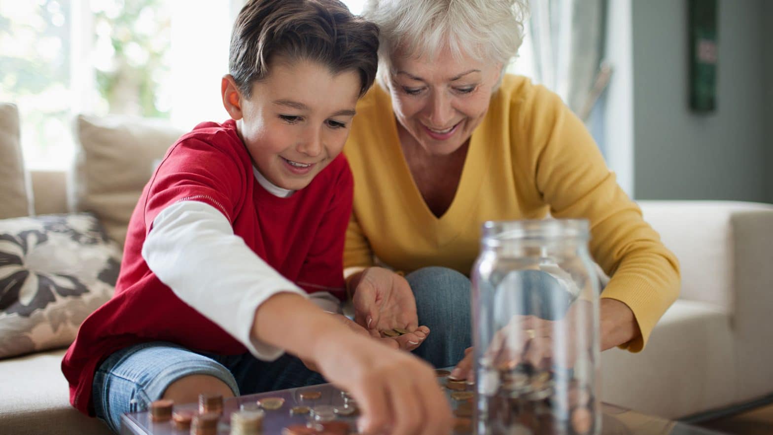 Grandmother and grandson counting coins