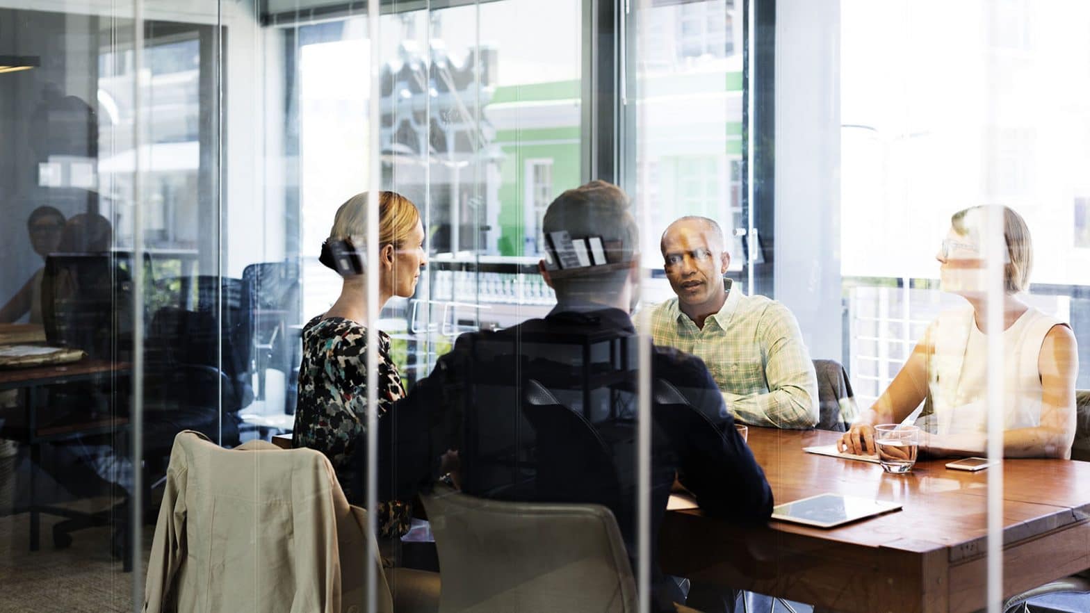 Business people discussing in boardroomPeople in a room talking