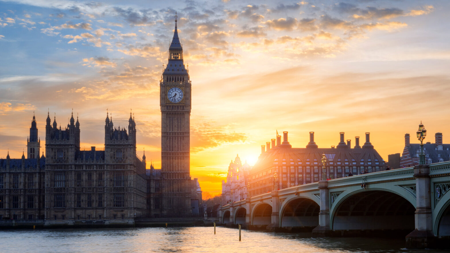 Big Ben and the Houses of Parliament shine at sunset, offering unique Property Perspectives from Westminster Bridge.